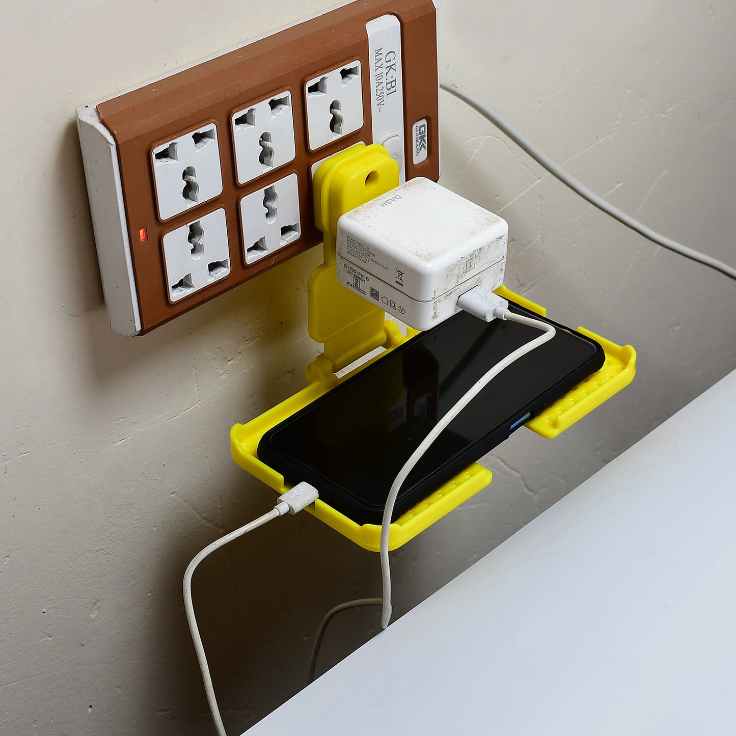 Multi-purpose Wall Holder Stand For Charging Mobile Just Fit In Socket And Hang (Yellow) - LootFaat