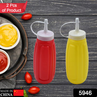 Set of 2 plastic squeeze bottles for sauces like ketchup and mustard.