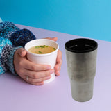 Double-walled stainless steel vacuum insulated coffee cup, travel mug without lid.