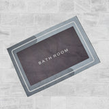 Water absorbent bathroom mat in grey.