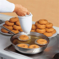 Plastic vada maker with dispenser.